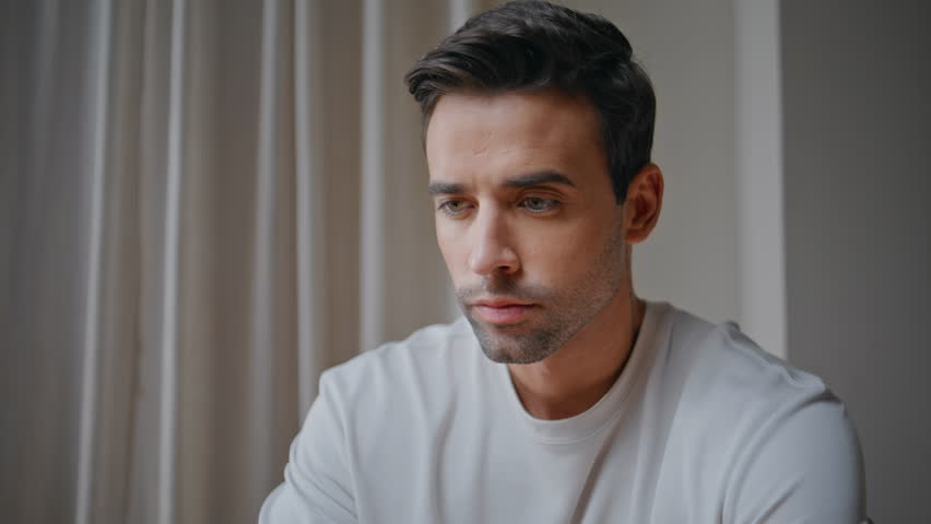 Pensive businessman planning project at office interior closeup. Professional manager thinking on corporate career sitting modern workplace. Serious remote worker pondering ideas at home apartment.