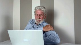 Senior elderly man touching his shoulder, suffering from shoulder pain, sciatica, sedentary lifestyle concept. shoulder health problems. Healthcare, insurance - Powered by Shutterstock - Get 15% off with code: PIKWIZARD15