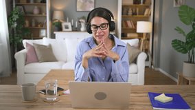 Happy woman student remote teacher tutor wear headphones video conference call online learning remote class webcam lesson looking at laptop virtual meeting working at home office. Female online dating - Powered by Shutterstock - Get 15% off with code: PIKWIZARD15