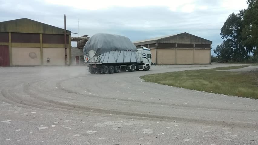 cotton truck enters the gin, cotton ginning mill