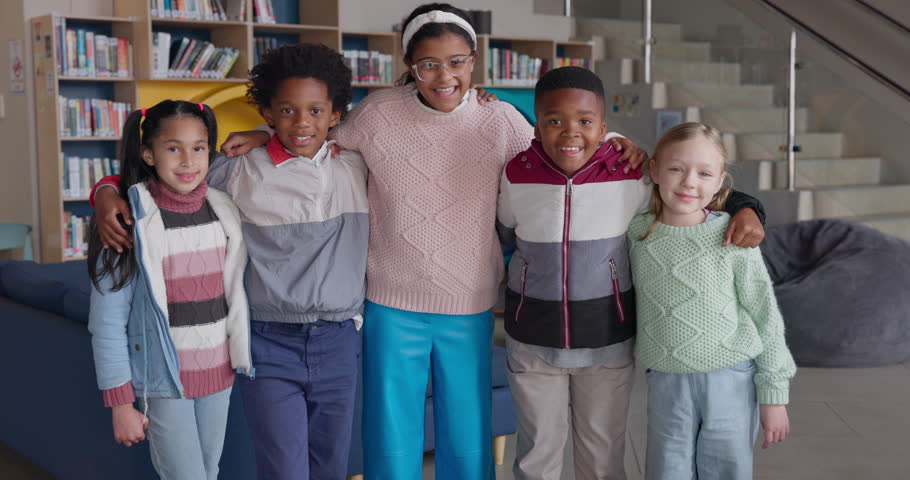 Face, hug and students with diversity, education and bonding together with confidence. Children, group and friends with embrace, school library and recreation centre with support, smile and happiness