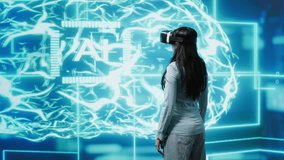 Developer wearing VR headset looking at hologram of artificial intelligence human brain simulation. Programmer interacting with AI visualization showing machine learning algorithms, camera A - Powered by Shutterstock - Get 15% off with code: PIKWIZARD15