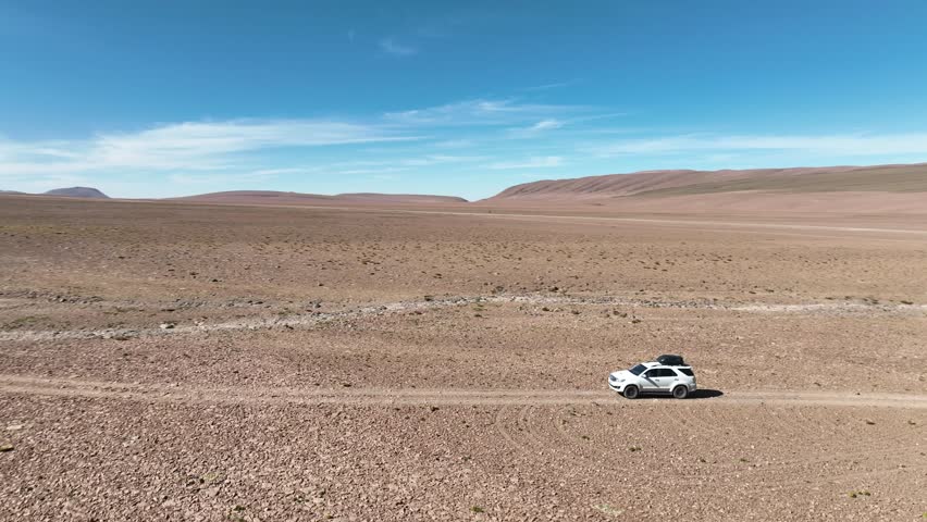 Atacama Desert, Chile. Car on the road. Aerial view by drone.