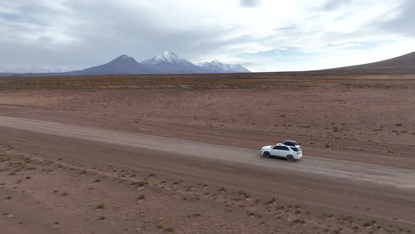 Atacama Desert, Chile. Car on the road. Aerial view by drone.