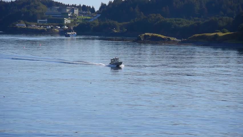 A shot of a boat sailing on the river in Kodiak, Alaska.