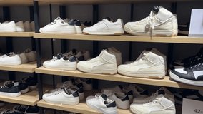 Shoes displayed on shelves in modern footwear store, retail fashion interior and shopping concept - Powered by Shutterstock - Get 15% off with code: PIKWIZARD15