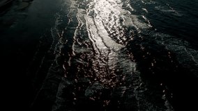 A night view of an artistic sea landscape with slow-motion waves and light reflections, creating a serene and mesmerizing scene. Location: Copenhagen, Denmark - Powered by Shutterstock - Get 15% off with code: PIKWIZARD15