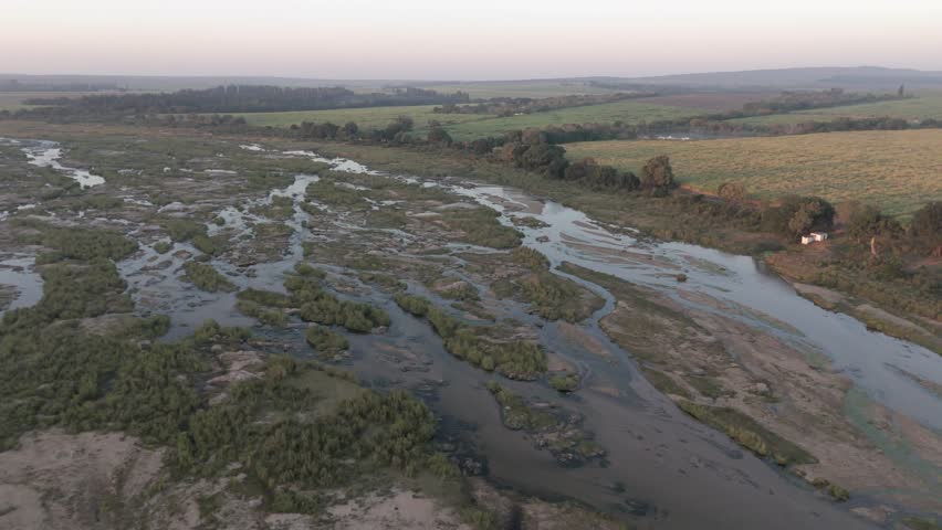 Crocodile River in South Africa’s Kruger Park at sunrise, aerial push-in