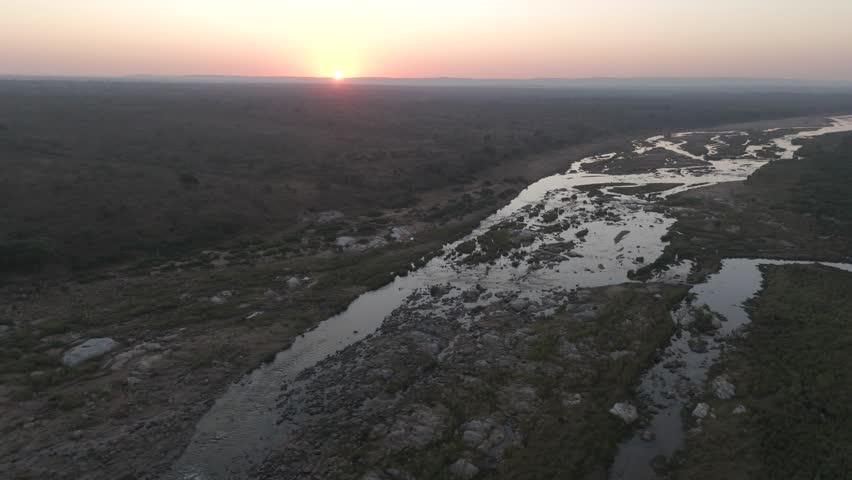 Spinning aerial of Crocodile River in Kruger National Park at sunrise