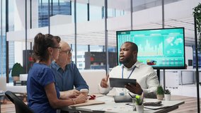 Senior couple exploring retirement plans options with financial banker to increase their life savings and secure the future family expenses. Financial goals with agency adviser. Camera B. - Powered by Shutterstock - Get 15% off with code: PIKWIZARD15