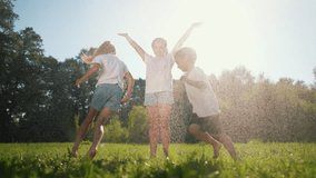 A group of children playing in the rain. Happy family kid dream concept. Children having fun in the rain playing with drops. A group of children are having lifestyle fun playing in the rain. - Powered by Shutterstock - Get 15% off with code: PIKWIZARD15