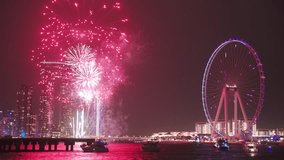 Spectacular fireworks display over Dubai Marina, highlighting the city’s skyline with the iconic Ferris wheel and illuminated skyscrapers, creating a festive and dazzling night scene.
 - Powered by Shutterstock - Get 15% off with code: PIKWIZARD15