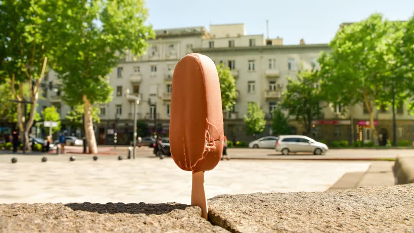 Time lapse close up slow motion ice cream melting in very hot summer day in direct sunlight. Concept heat wave summer holidays extreme temperatures and global warming affects.Tbilisi.Georgia.Caucasus