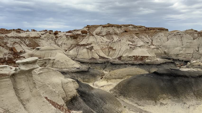 Hiking in Bisti Badlands near Farmington New Mexico, Bisti De Na Zin Wilderness, authentic natural landscape scenery, otherworldly, Mars surface, mysterious, Venus surface, extraterrestrial, untouched