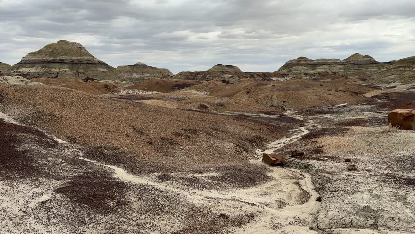 Hiking in Bisti Badlands near Farmington New Mexico, Bisti De Na Zin Wilderness, authentic natural landscape scenery, otherworldly, Mars surface, mysterious, Venus surface, extraterrestrial, untouched