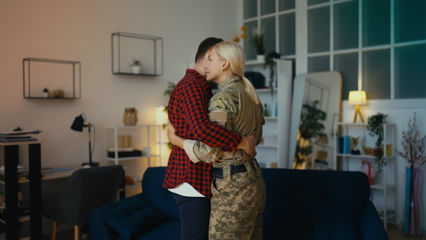 Middle-aged husband dancing with military spouse, enjoying weekend rest, love