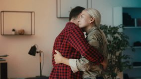 Civilian husband dancing with military wife, close relationship, homecoming - Powered by Shutterstock - Get 15% off with code: PIKWIZARD15