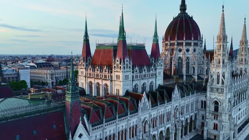 drone view of parliament building in Budapest at sunrise, tourist attraction in Hungary, beautiful gothic architecture in Hungary capital. High quality 4k footage
