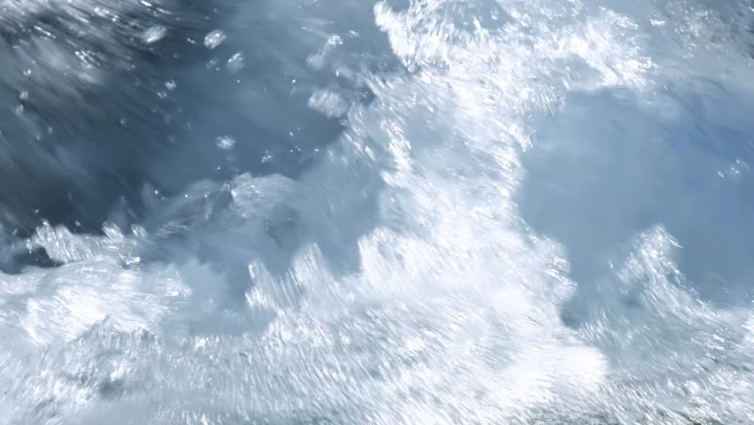 Water flowing in the river. Slow motion.