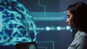 AI computer scientist using laptop for business data analysis in high tech workspace. Close up shot of Indian woman working on notebook to automatize tasks using artificial intelligence, camera B - Powered by Shutterstock - Get 15% off with code: PIKWIZARD15