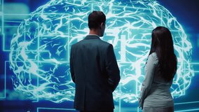 IT staff members using artificial intelligence computing simulating human brain thought processes. Coworkers building AI machine learning algorithms in futuristic workspace, camera B - Powered by Shutterstock - Get 15% off with code: PIKWIZARD15