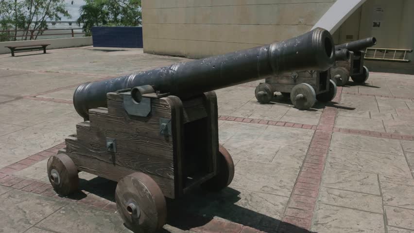 Old colonial canons at Panama Viejo. You can see 3 black canons with wheels that were used do defend against pirates. 4k slow motion gimbal video