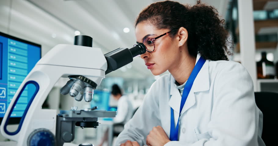 Woman, microscope and scientist in laboratory for research, drug experiment or innovation. Science, biotechnology and female doctor with medical equipment for chemical sample analysis or testing