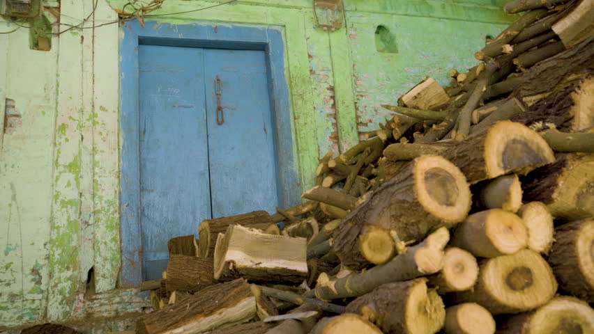 Chopped wood logs at village house, India
