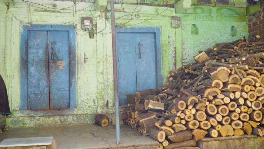 Chopped wood logs at village house, India