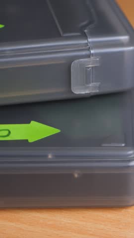 External hard drive and boxes with HDD with backup text label. Electro-mechanical data storage device stores and retrieves digital data using magnetic storage. Save information. 2.5-inch form factor