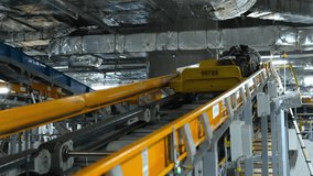 Moving luggage passes on airport baggage conveyor belts. Unmanned shooting. High-tech luggage handling system - Powered by Shutterstock - Get 15% off with code: PIKWIZARD15