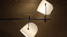 metal lampshades close up. Metal chandeliers in the interior. Retro style lamps with large lampshade. Close-up. vertical video - Powered by Shutterstock - Get 15% off with code: PIKWIZARD15