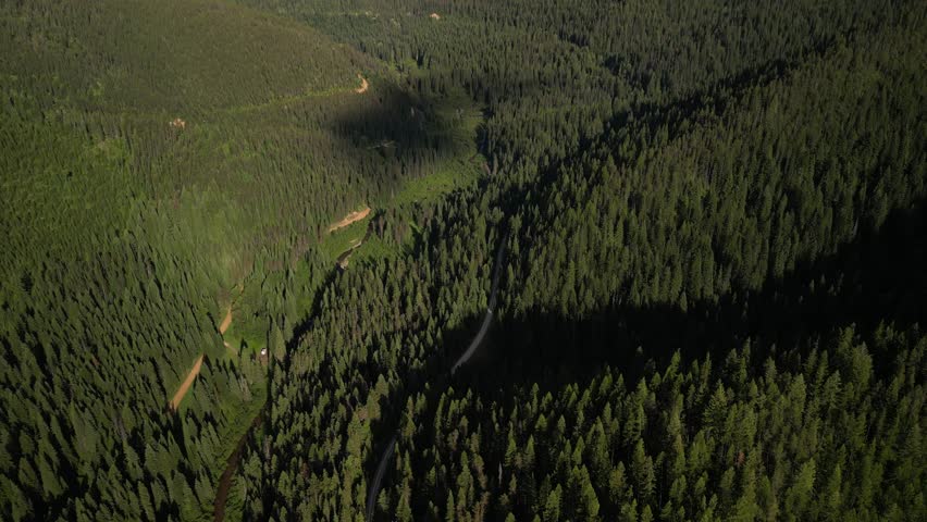 Aerial of biking Route of the Hiawatha in Idaho and Montana mountains on old railroad in summer