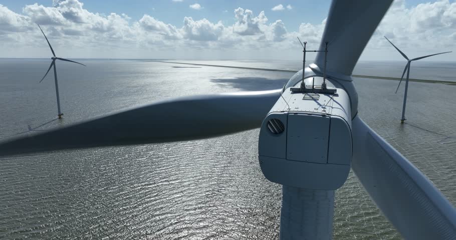 Wind turbine at Breezanddijk, De Afsluitdijk, The Netherlands, close up aerial view.