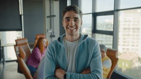 Ambitious startup owner crossing arms on waist while standing ahead of table for conference in modern interior. Team of entrepreneurs getting ready for discussing new business ides in morning. - Powered by Shutterstock - Get 15% off with code: PIKWIZARD15