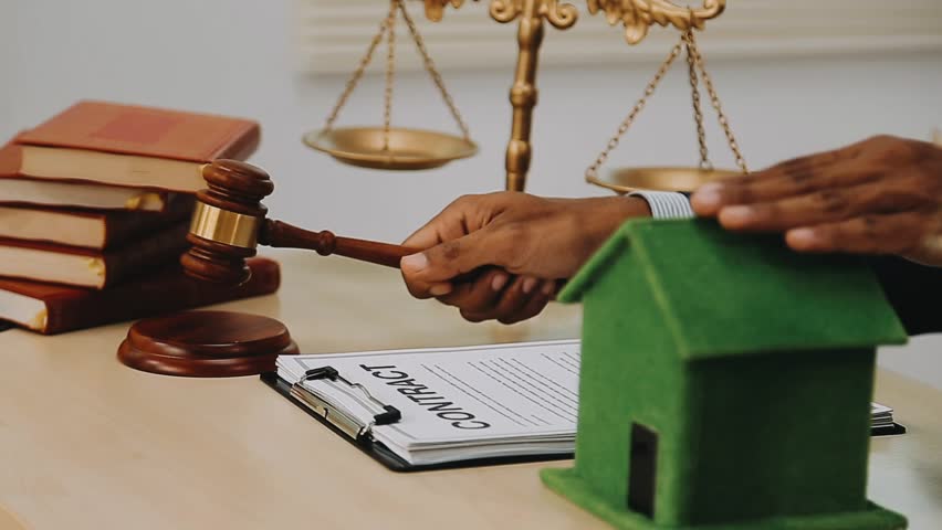 Judge hammer and model house, real estate dispute, real estate auction
