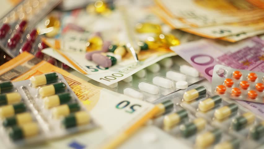Background video close-up of pills and euro bills. Money and treatment, buying medicine at a pharmacy. High quality 4k footage