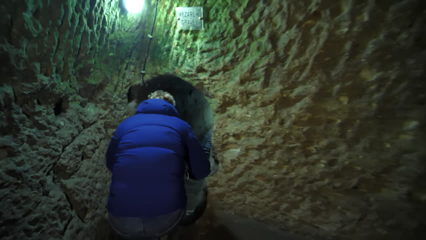 Russian guide talks about ancient Christian caves in Cappadocia. Turkey.