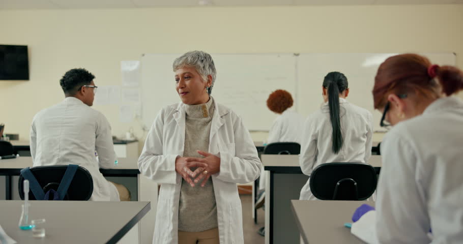 School, biology and teacher with students in classroom for learning, education and chemistry lesson. University, science and woman talking, teaching and explain for assignment, studying and exam