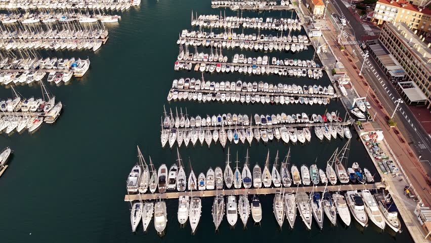 Drone of the port in Marseille, France. A Plenty of boats, sailboats, speedboats and yachts moored in the port, aerial shot
