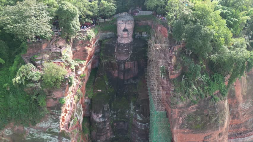Leshan Giant Buddha (Leshan Grand Buddha) near Chengdu, Sichuan, China. The tallest stone Buddha statue in the world. Aerial Drone View. RAW images - no filter.