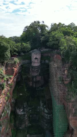 Leshan Giant Buddha (Leshan Grand Buddha) near Chengdu, Sichuan, China. The tallest stone Buddha statue in the world. Aerial Drone View. RAW images - no filter.