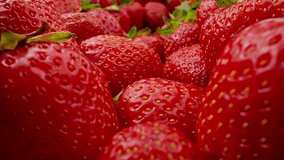 Ripe red strawberries. Strawberries are perfectly ripe and ready to be eaten. Delicious summer berries. Vegetarian Food. Organic food concept. Dolly in shot. Close-up in 4K, UHD - Powered by Shutterstock - Get 15% off with code: PIKWIZARD15