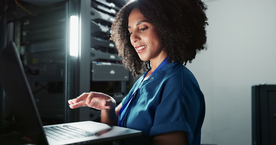 Smile, engineer and woman on laptop in data center for cyber security, coding and update database. Happy, technician and computer in server room for information technology, typing and programming