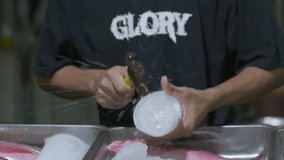 Smashing Ice with a hammer in a fish market - Powered by Shutterstock - Get 15% off with code: PIKWIZARD15