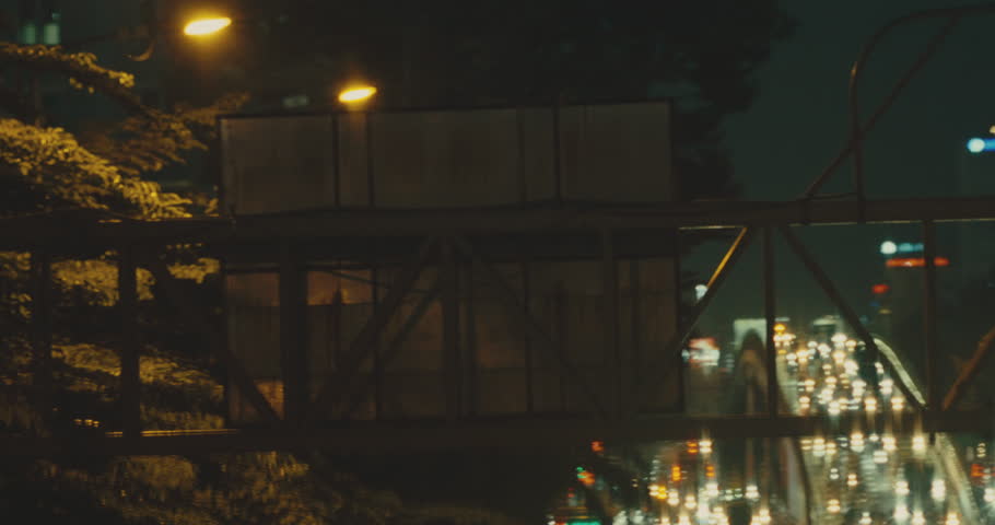 Galvanized Frame Steel Gate And Traffic Sign Poles At Night In The City. Selective Focus Shot