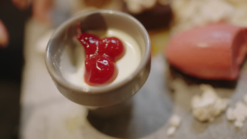 Experience the allure of Asian fusion cuisine with this close-up of a delicious dessert being scooped by a spoon. Great for showcasing gourmet food, restaurant advertisements, and food culture.