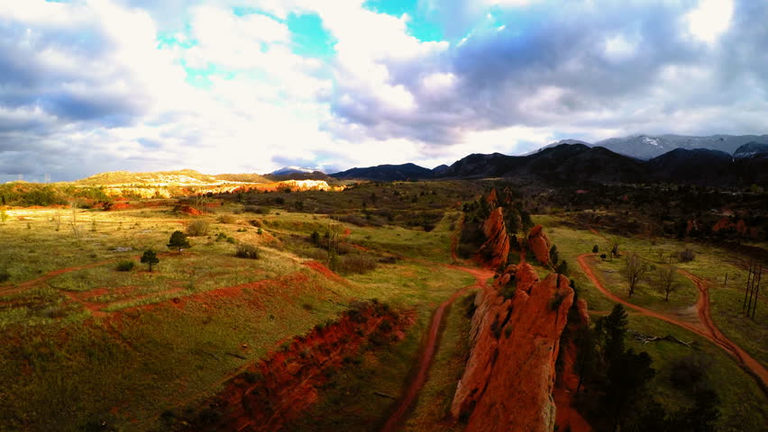 Aerial Backward Beautiful View Of Rock Formations Under Cloudy Sky - Colorado Springs, Colorado
