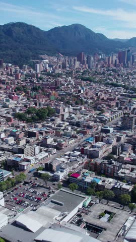 Vertical Aerial View of Bogota, Colombia. Flying Above Residential Neighborhood Under Green Hills, Drone Shot
