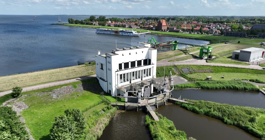 An aerial of the electrically powered pumping station Lely along the Ijsselmeer Lake on a sunny day in the Netherlands